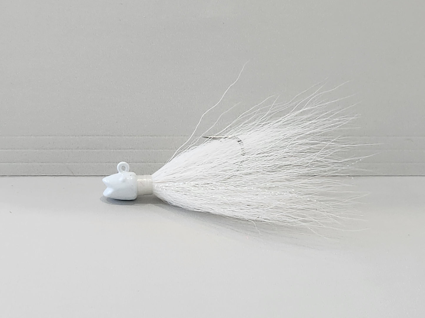Smiling bill White bucktail jig