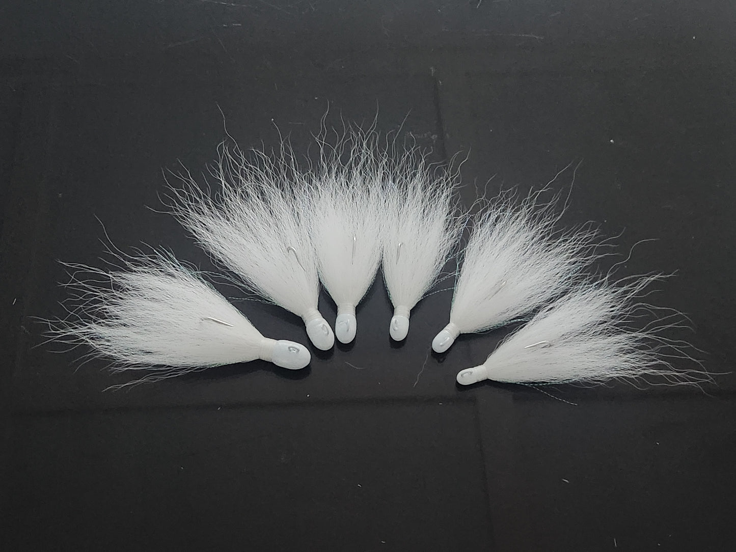 White bucktail jig with extra long hair.